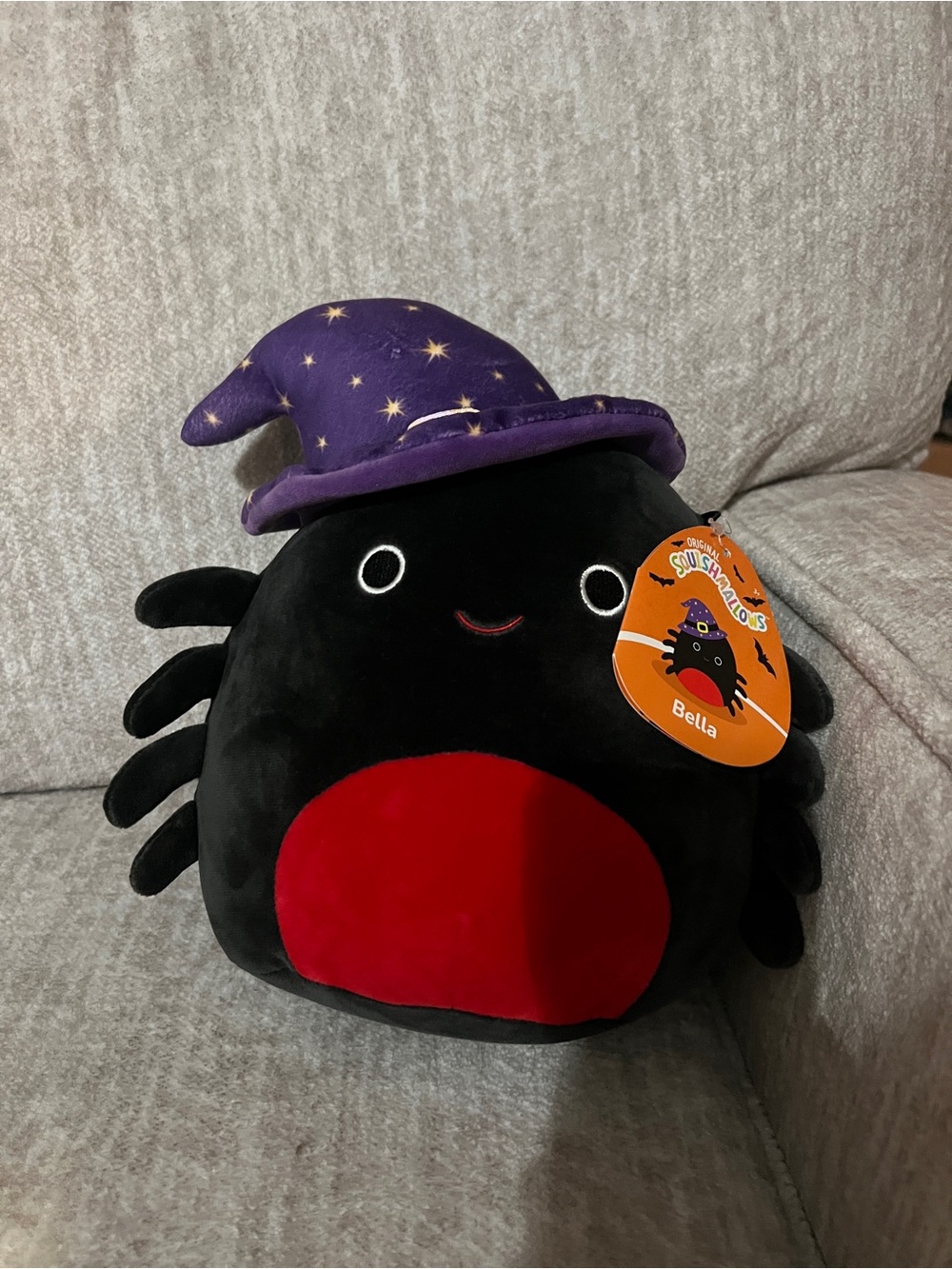 Squishmallows Bella Black Spider Plush with Purple Star Hat and Red Belly